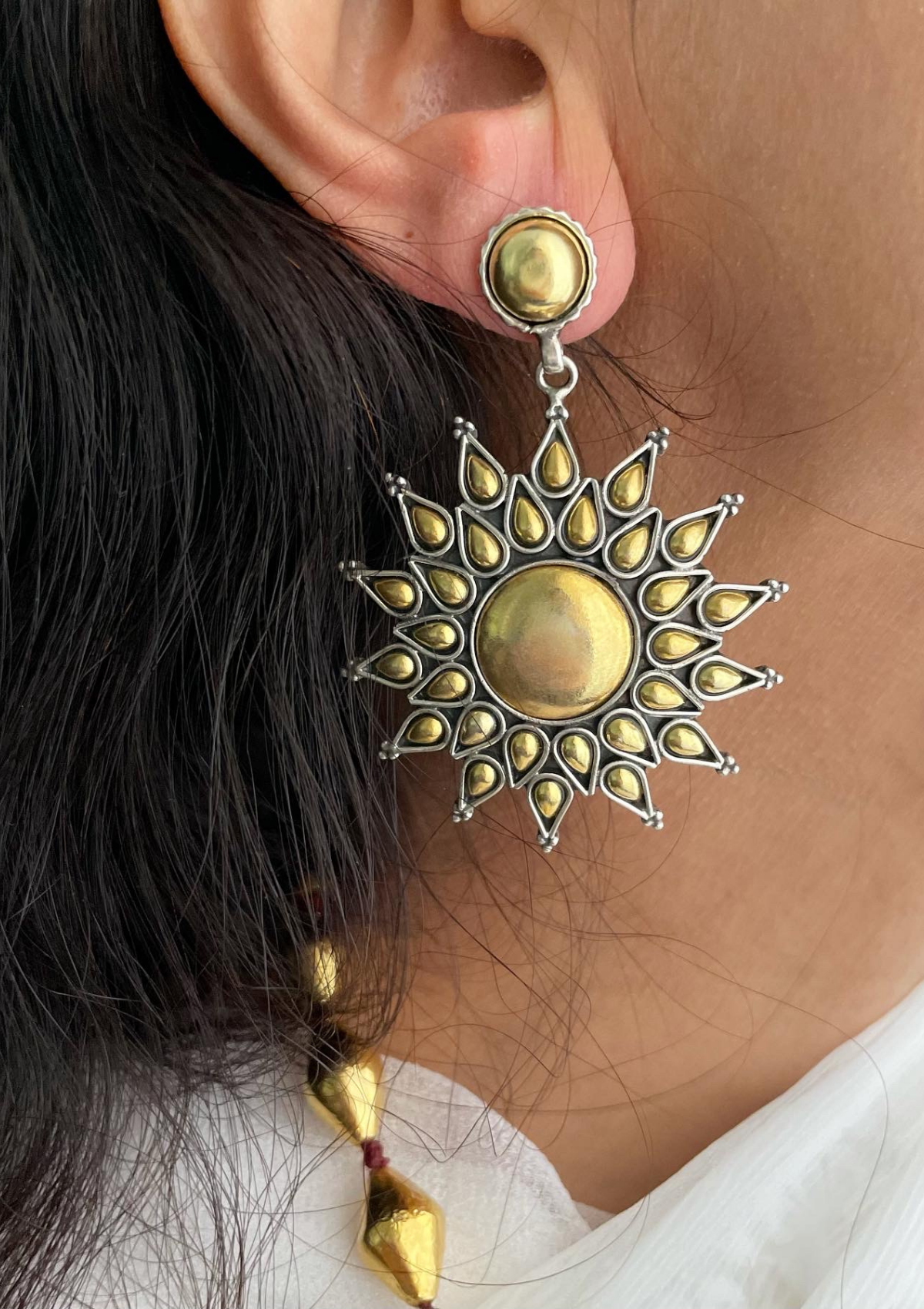 Surya earrings made from sterling silver with gold plating